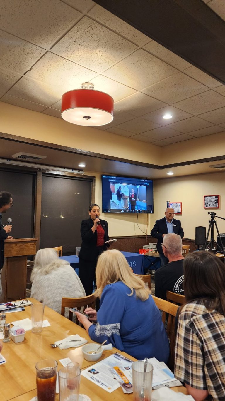Christine Salazar speaking at a Democratic club meeting